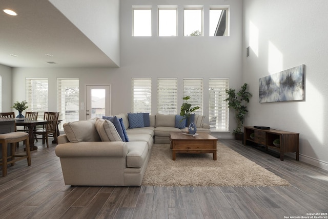 living room with dark wood-type flooring