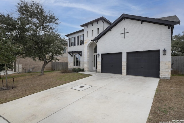 view of front facade with a garage and a front lawn