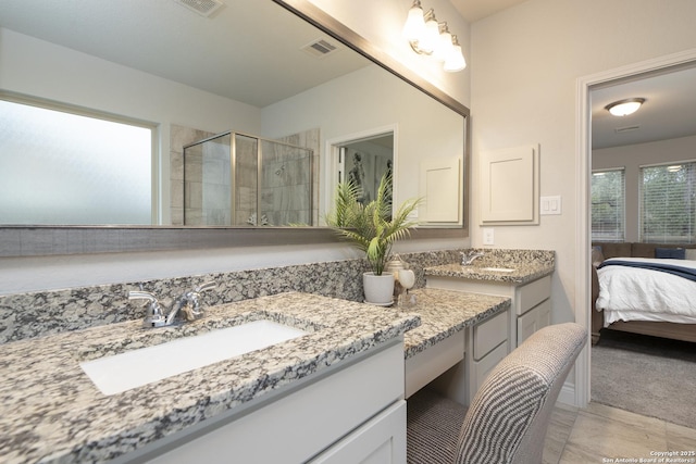 bathroom with vanity and an enclosed shower