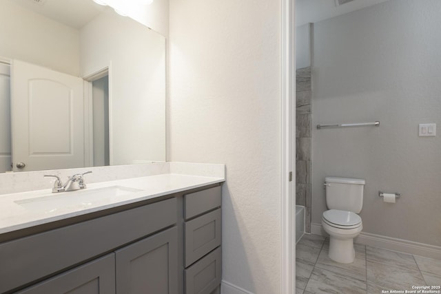 full bathroom featuring vanity, toilet, and washtub / shower combination