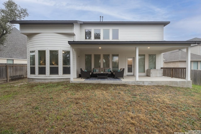 back of house with a yard, outdoor lounge area, and a patio area