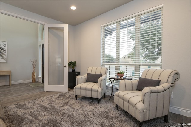 living area with french doors and dark hardwood / wood-style flooring