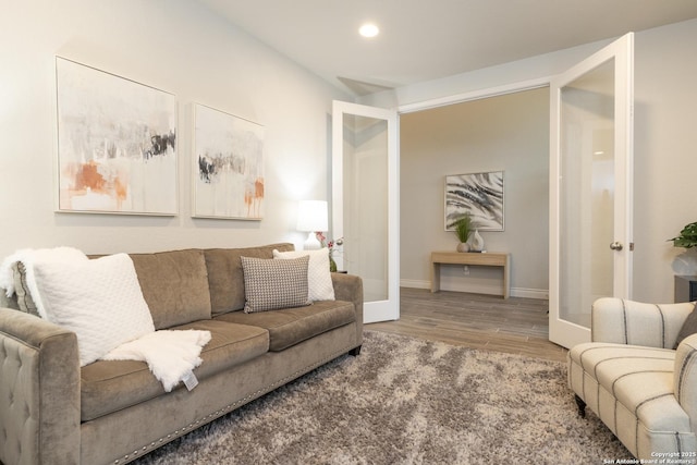 living room featuring hardwood / wood-style flooring and french doors