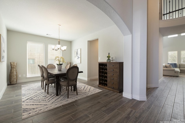 dining space featuring a notable chandelier