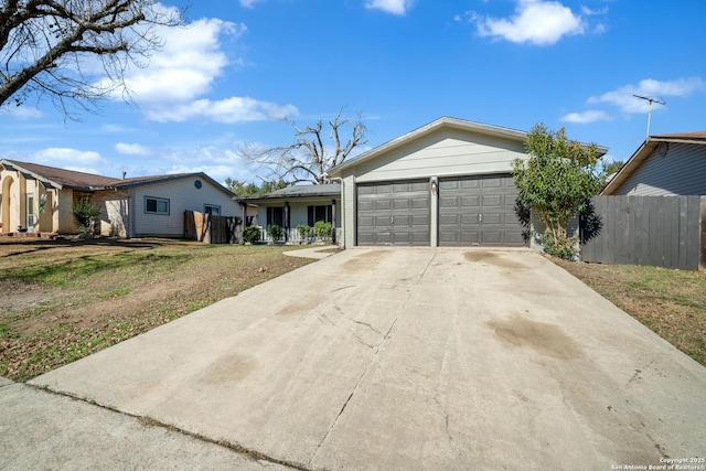 ranch-style home with a garage and a front yard