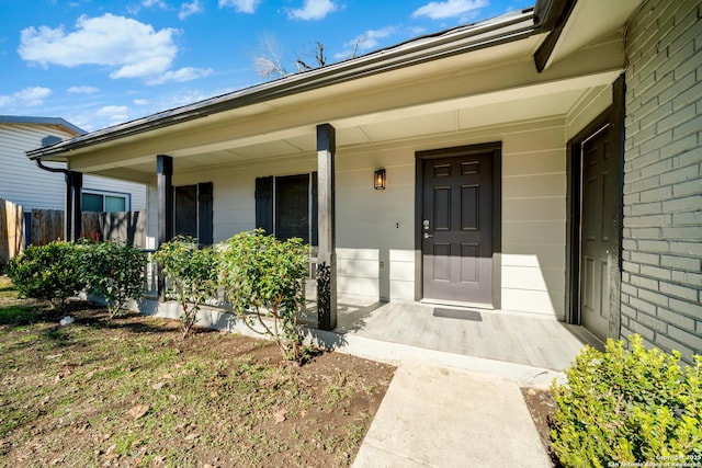 doorway to property featuring a porch