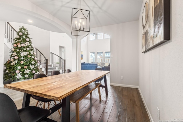 dining room with an inviting chandelier and wood-type flooring