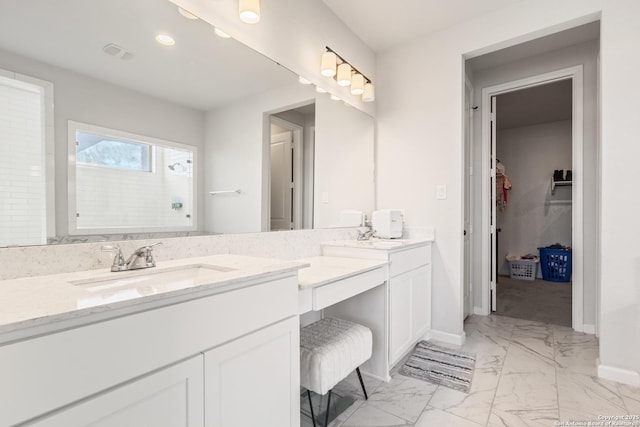 bathroom with vanity and walk in shower