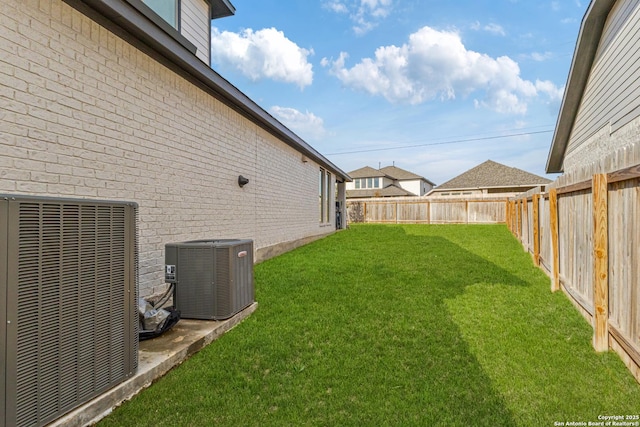 view of yard featuring central AC