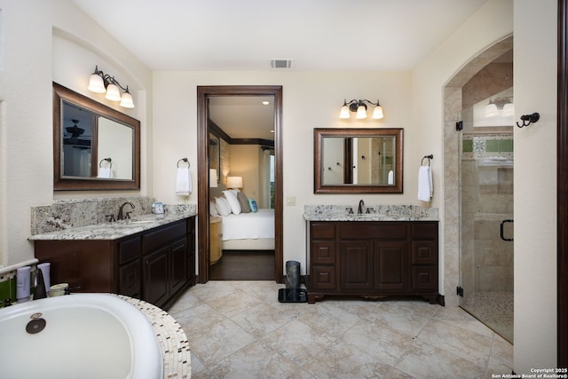 bathroom with vanity and a shower with shower door