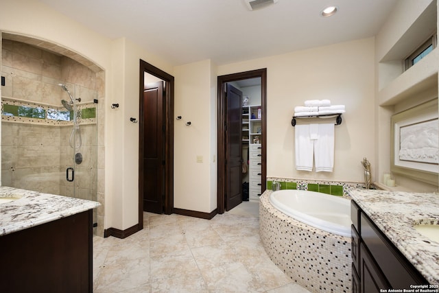 bathroom with vanity and plus walk in shower