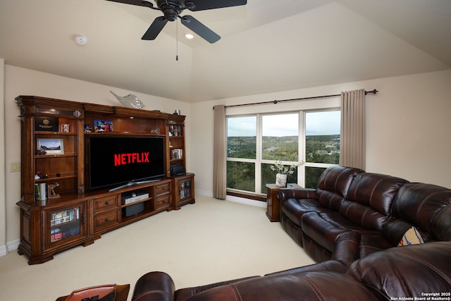 carpeted living room with lofted ceiling and ceiling fan