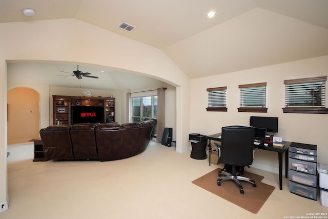 carpeted office space featuring ceiling fan and lofted ceiling