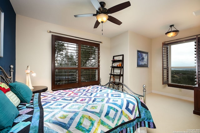 carpeted bedroom with ceiling fan