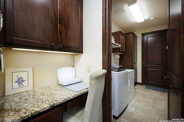 laundry area with cabinets and independent washer and dryer