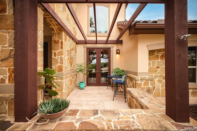 entrance to property with a patio and french doors