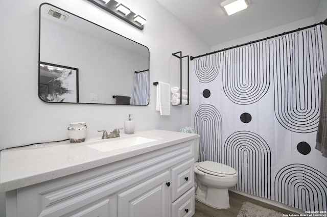 bathroom with vanity and toilet