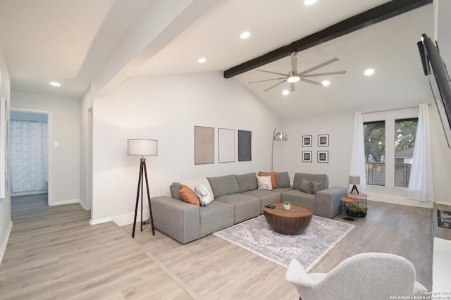 living room featuring ceiling fan, light hardwood / wood-style floors, and lofted ceiling with beams