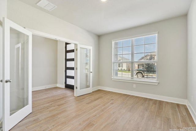 interior space featuring light hardwood / wood-style flooring and french doors