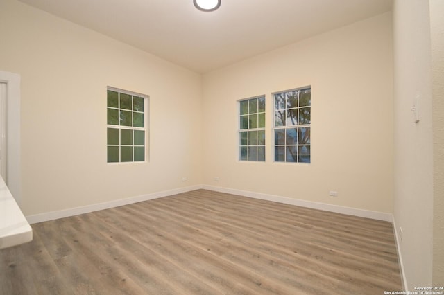 empty room with hardwood / wood-style floors