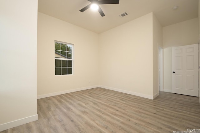 spare room featuring ceiling fan and light hardwood / wood-style floors