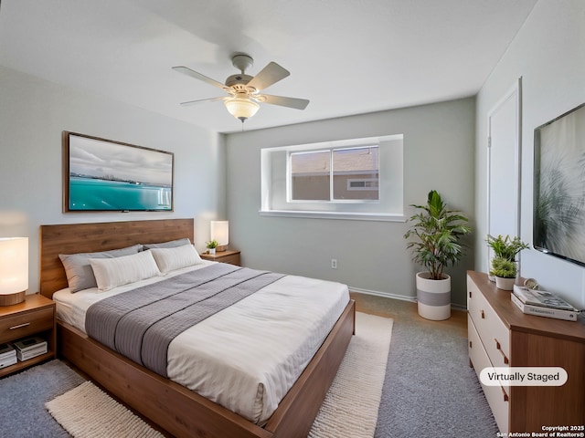 carpeted bedroom with ceiling fan