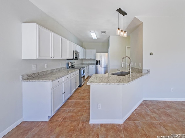 kitchen featuring white cabinetry, sink, pendant lighting, and stainless steel appliances