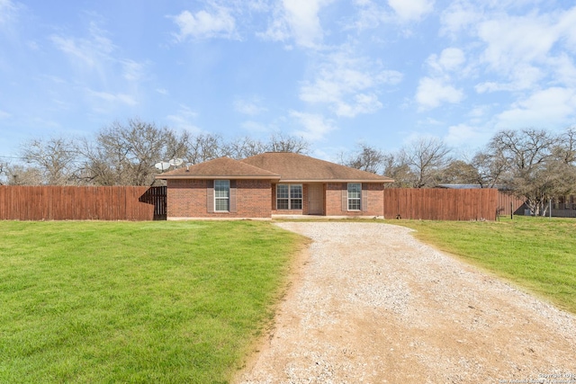 ranch-style home with a front lawn