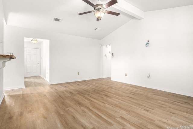 spare room with ceiling fan, vaulted ceiling with beams, and light hardwood / wood-style floors