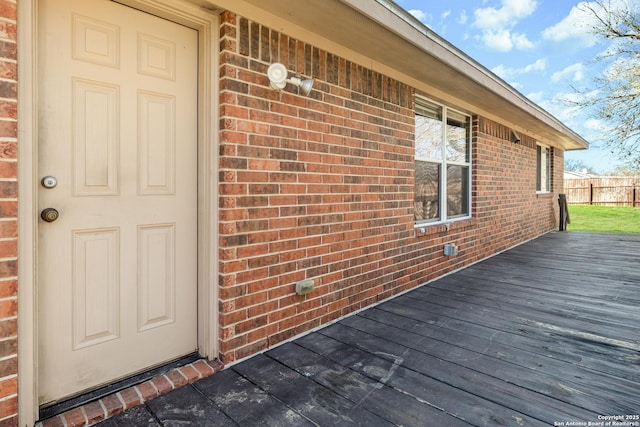 entrance to property with a deck