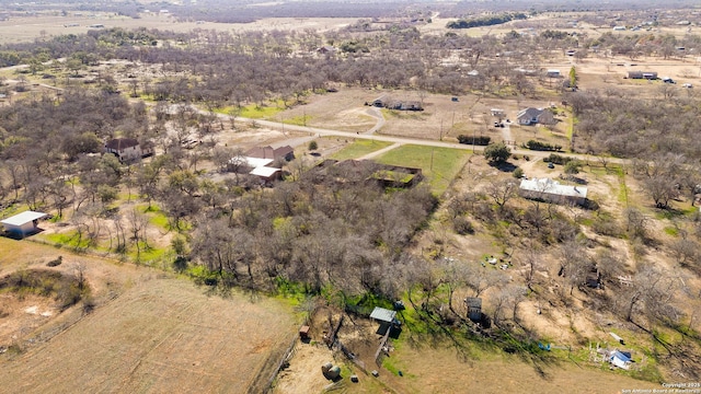 birds eye view of property featuring a rural view