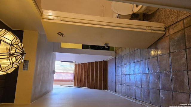 hallway featuring concrete flooring