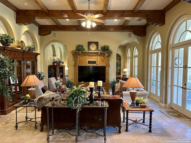 living room with beamed ceiling, coffered ceiling, and french doors