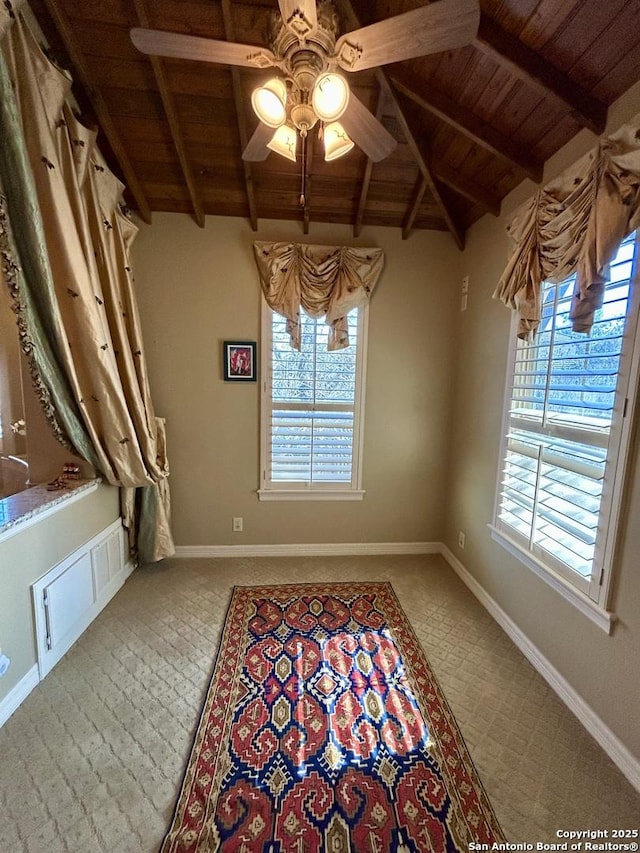 unfurnished dining area with lofted ceiling with beams, ceiling fan, and wood ceiling