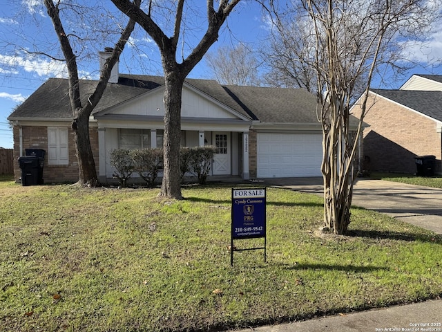 ranch-style house with a garage and a front yard