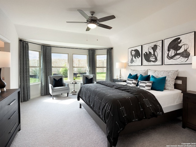 bedroom featuring light carpet and ceiling fan