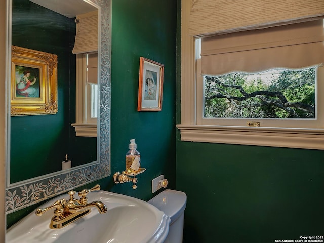 bathroom with toilet and sink