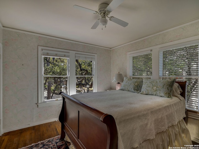 bedroom featuring crown molding, ceiling fan, and hardwood / wood-style floors