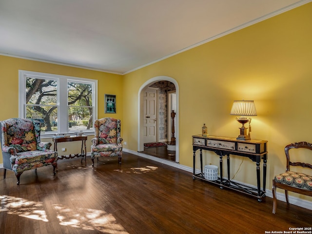 sitting room featuring hardwood / wood-style floors and crown molding