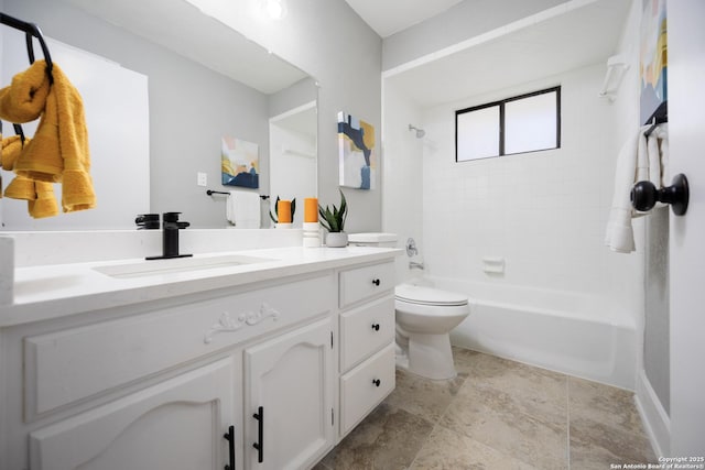 full bathroom with vanity, toilet, and tiled shower / bath