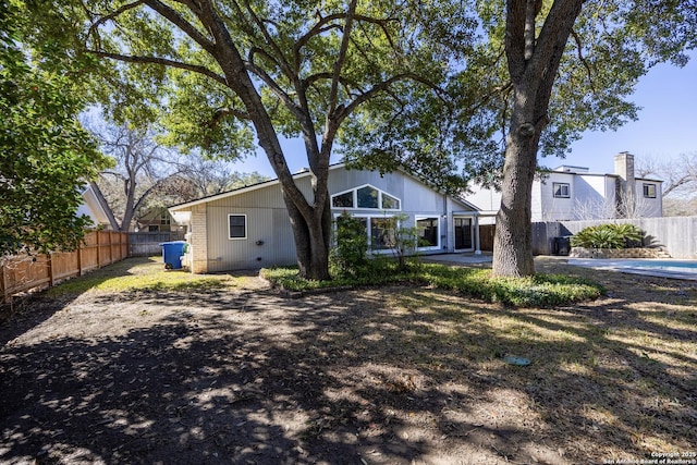 rear view of property featuring a patio