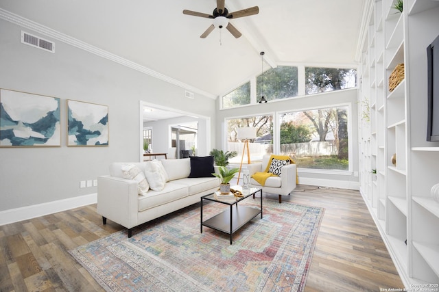 living room with hardwood / wood-style floors, crown molding, high vaulted ceiling, and ceiling fan