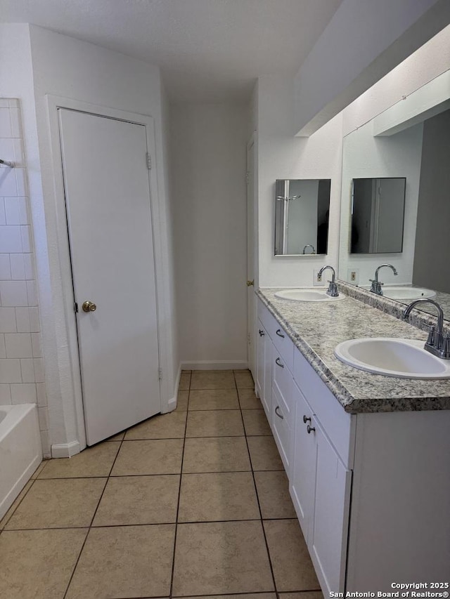 bathroom with vanity and tile patterned flooring