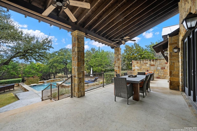 view of patio / terrace featuring outdoor dining area, an outdoor pool, and ceiling fan