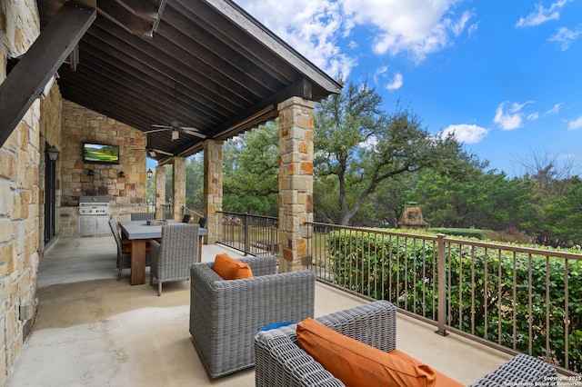 view of patio / terrace with outdoor dining area, area for grilling, an outdoor living space with a fireplace, a ceiling fan, and a grill