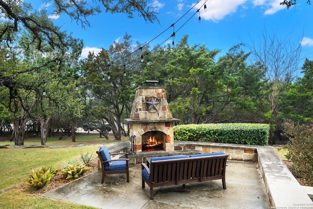 view of patio featuring an outdoor living space with a fireplace