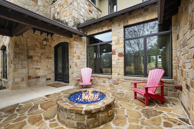 view of patio / terrace with a fire pit