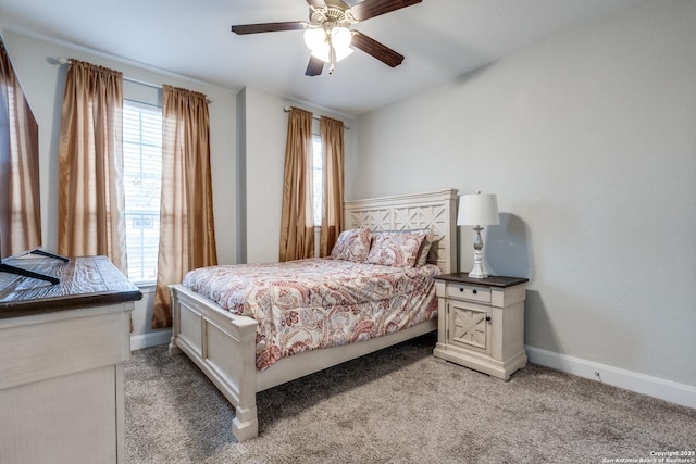 bedroom featuring multiple windows, light carpet, and ceiling fan