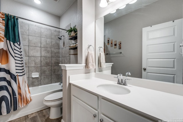 full bathroom with wood-type flooring, toilet, shower / tub combo with curtain, and vanity