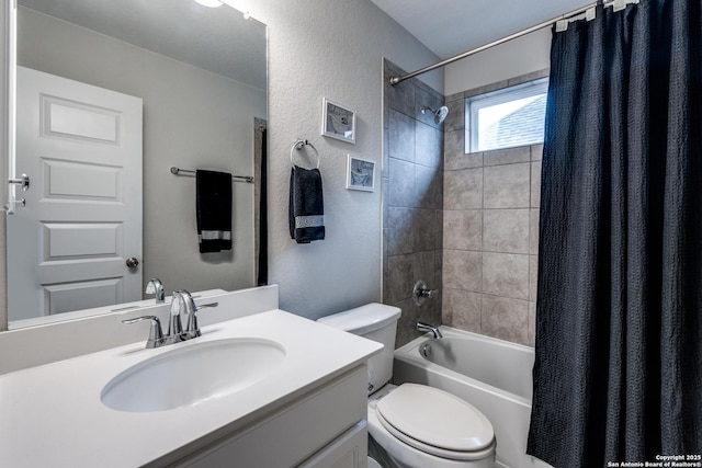 full bathroom featuring shower / bathtub combination with curtain, vanity, and toilet